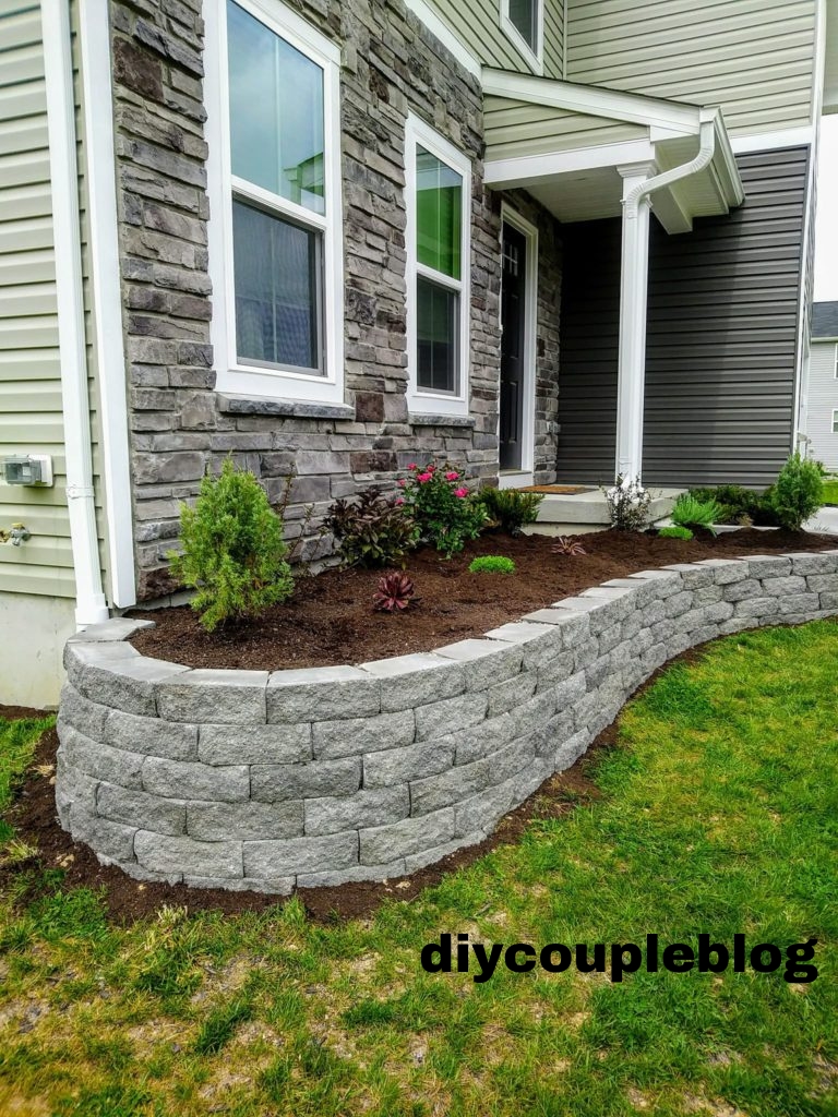 stone retaining wall flower bed