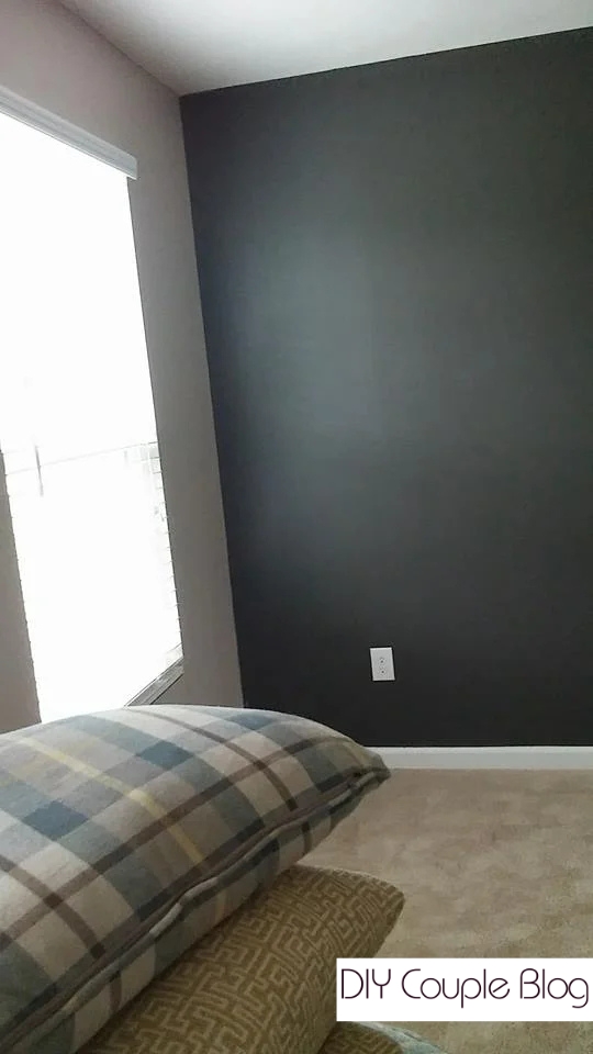 Moody living room with dark gray charcoal paint.