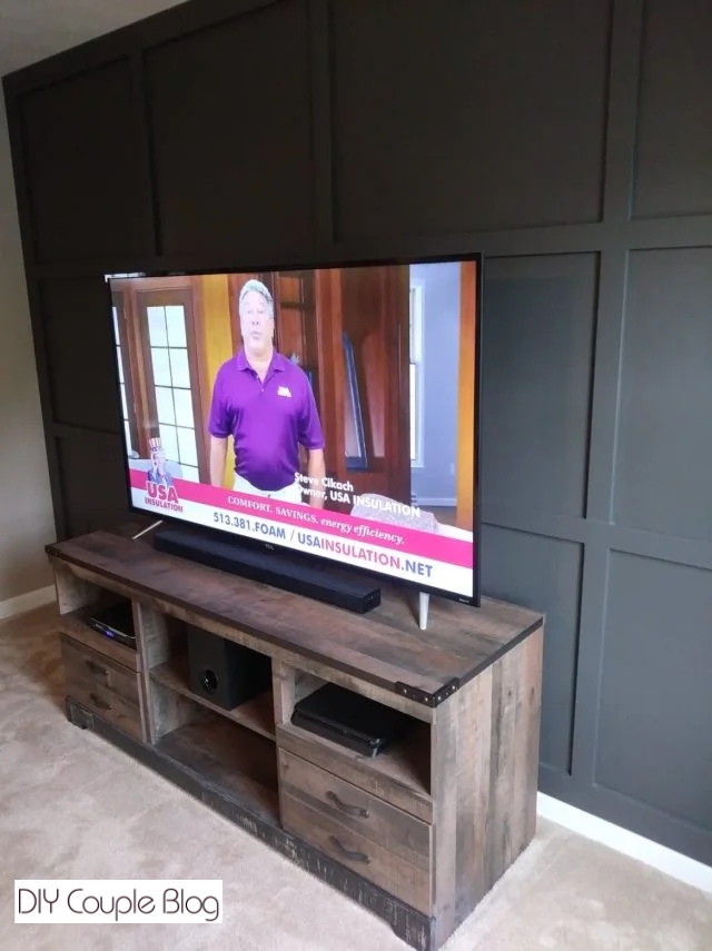TV sitting on wood TV stand