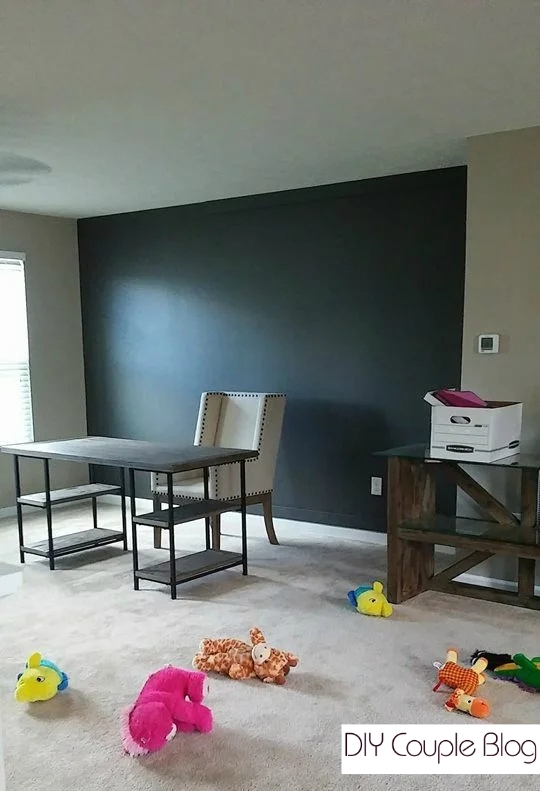 living room accent wall with paint color called urbane bronze.