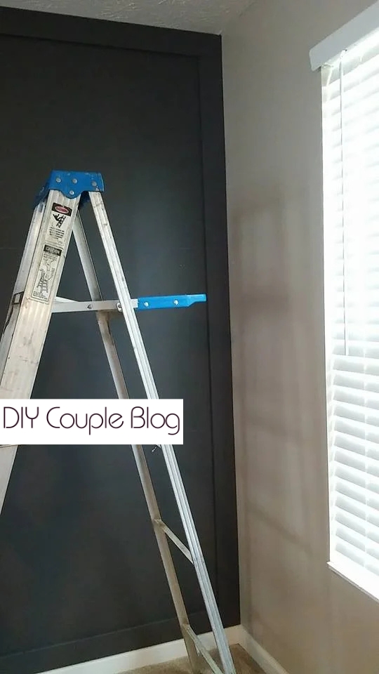 adding outer primed MDF boards to the wall to create a board and batten grid.
