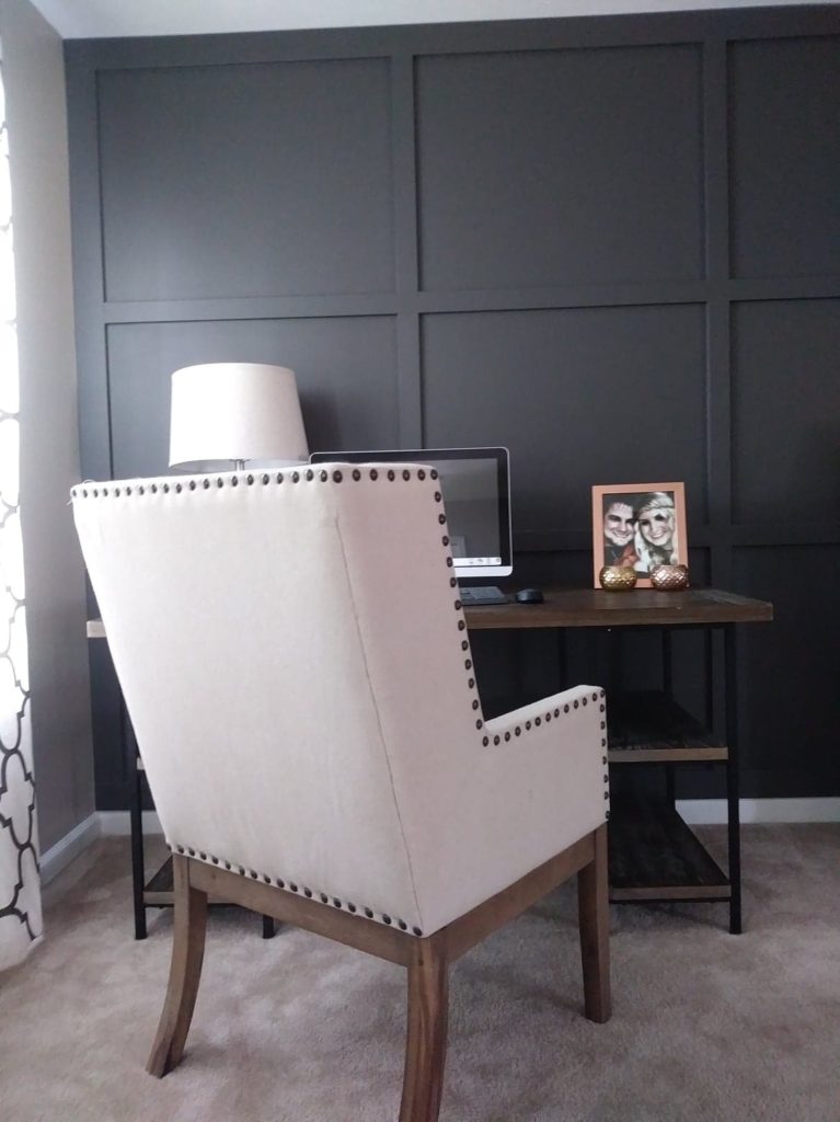 living room desk in front of board and batten