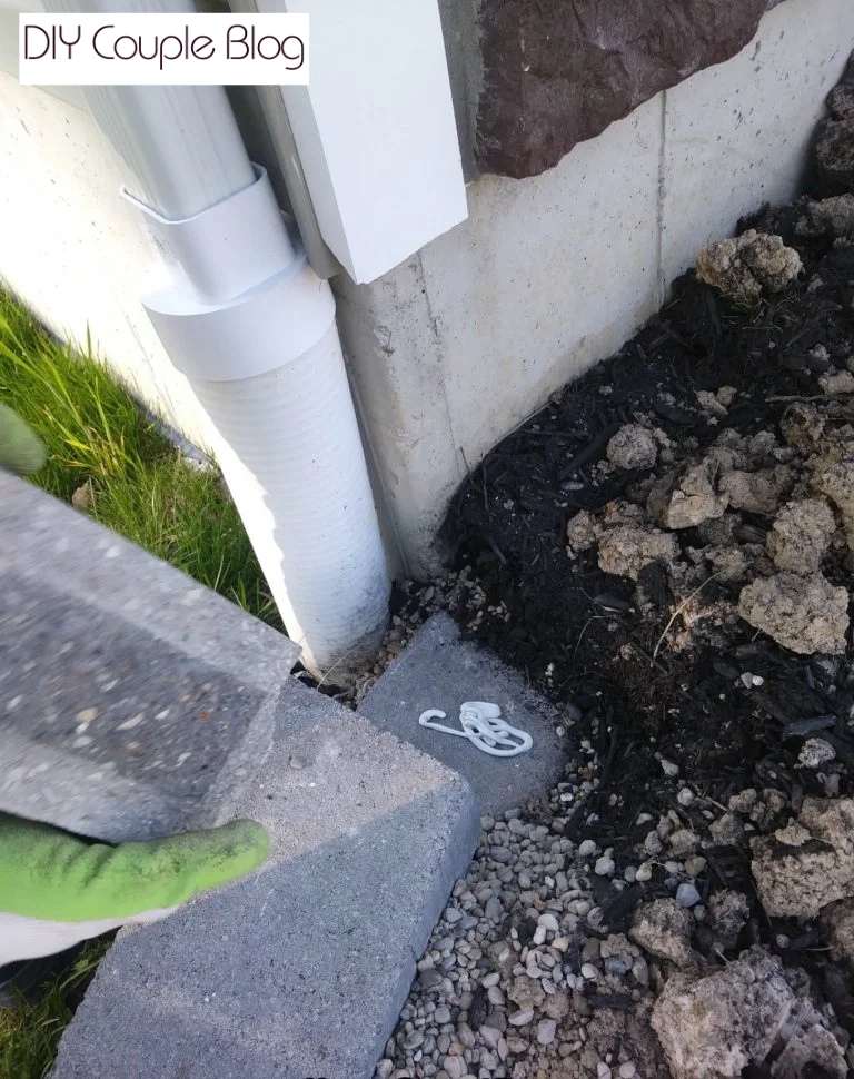 showing outdoor construction adhesive  being applied when stacking the wall blocks 