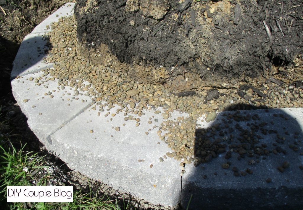 curved garden bed bordered by a stone wall