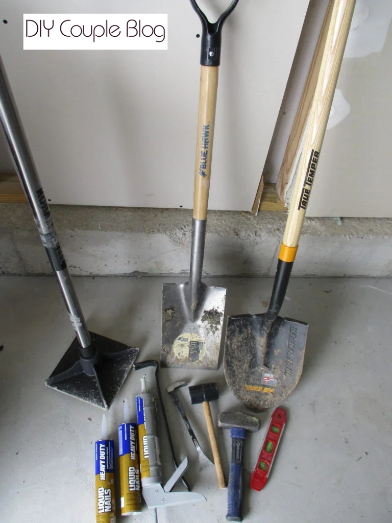 prepping tools to build a concrete block retaining wall