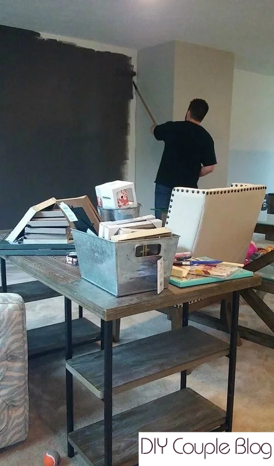 homeowner using Sherwin Williams Urbane bronze paint on the wall for accents.