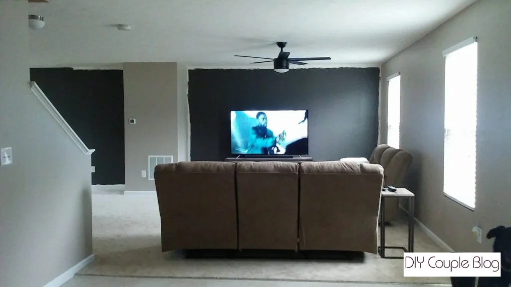 painting the two large accent walls in our living room with dark charcoal gray.