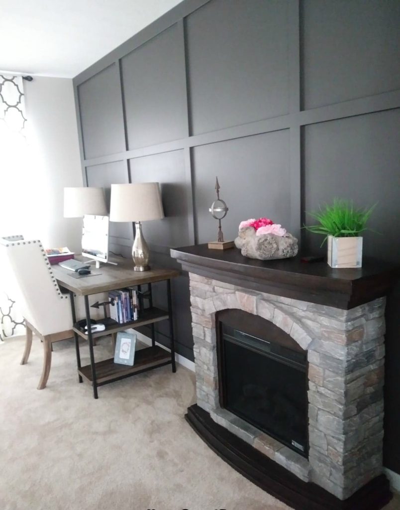 living room with new paint colors and a finished board and batten wall