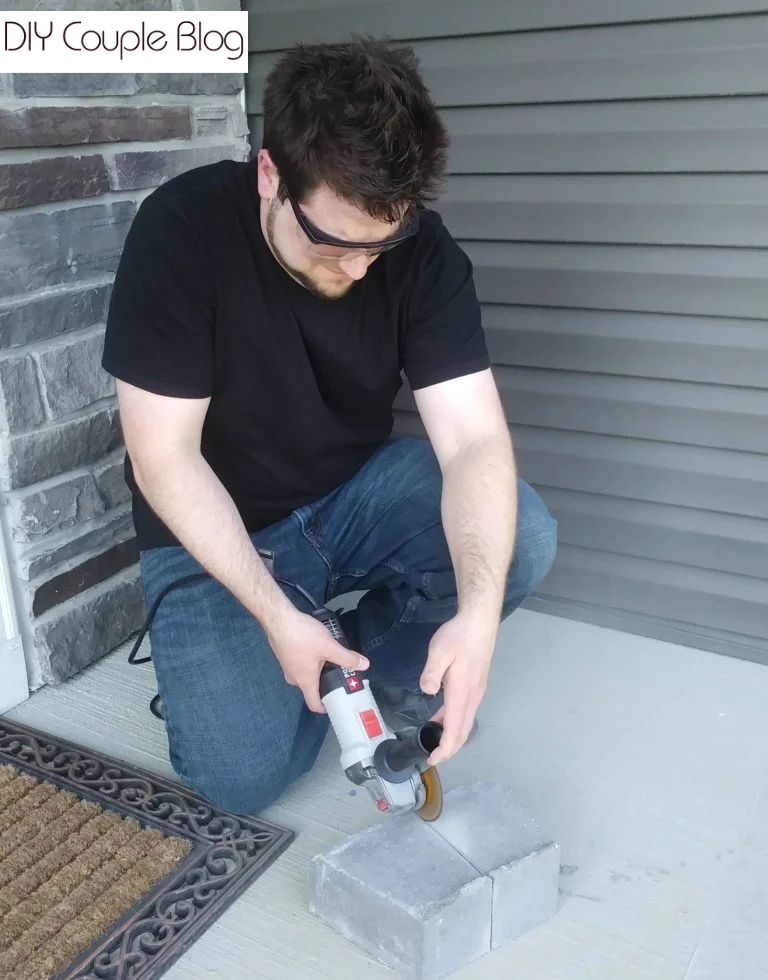 homeowner cutting concrete block with angle grinder 