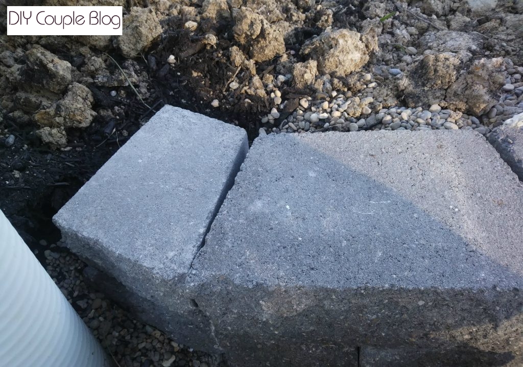 showing the cut piece of stone on the end of retaining wall