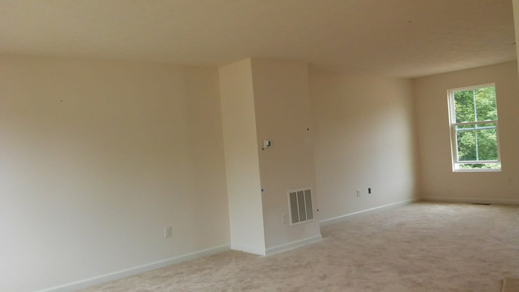white wall before home living room accent wall transformation