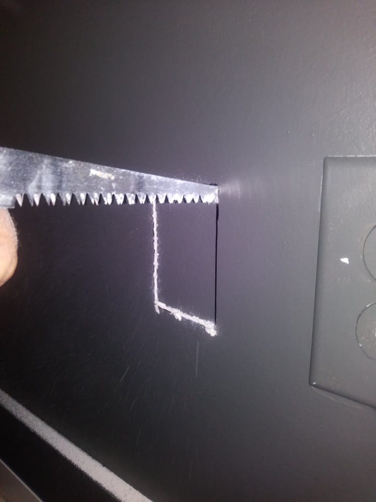 cutting hole to hide tv wires behind wall