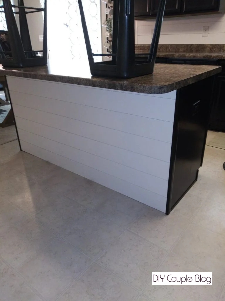 white shiplap on a kitchen island base 