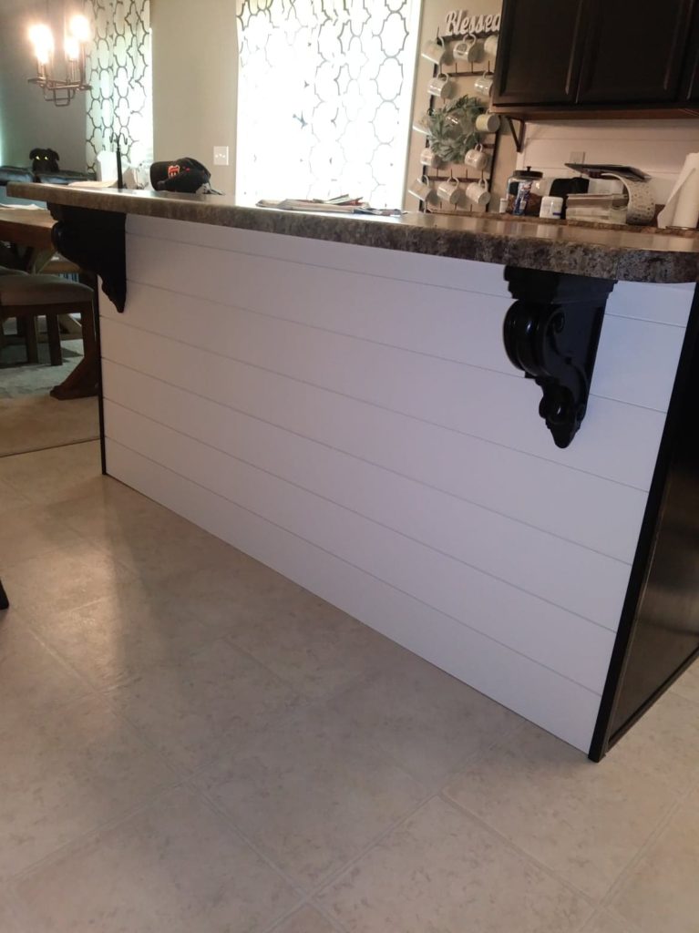 decorative corbels on our shiplap kitchen island 