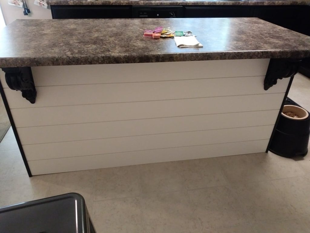 black kitchen island corbels with shiplap island