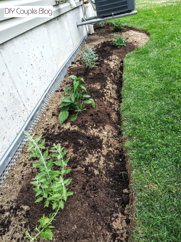 the process of landscaping around our air conditioner