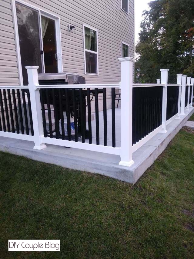 a look at the before with grass surrounding the backyard concrete porch