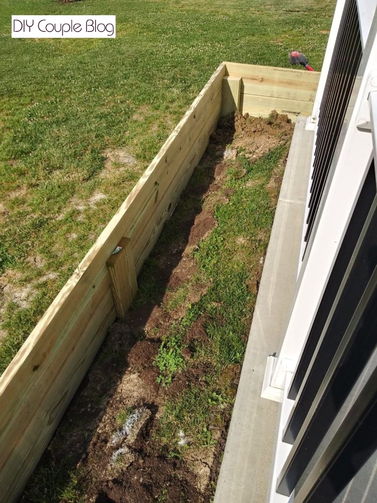 adding support throughout the middle section of the raised garden bed