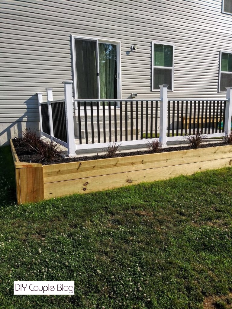 easy to build wood flower bed wrapping around the house