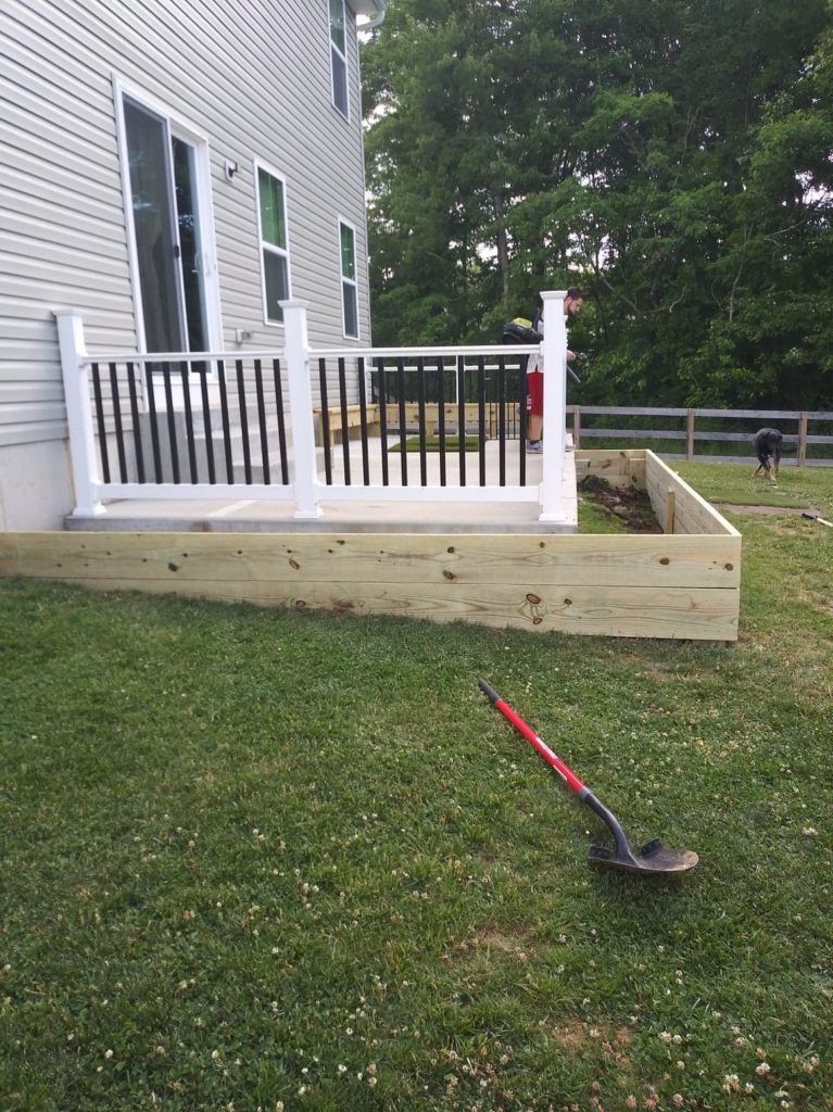 raised bed around patio, before filled with dirt