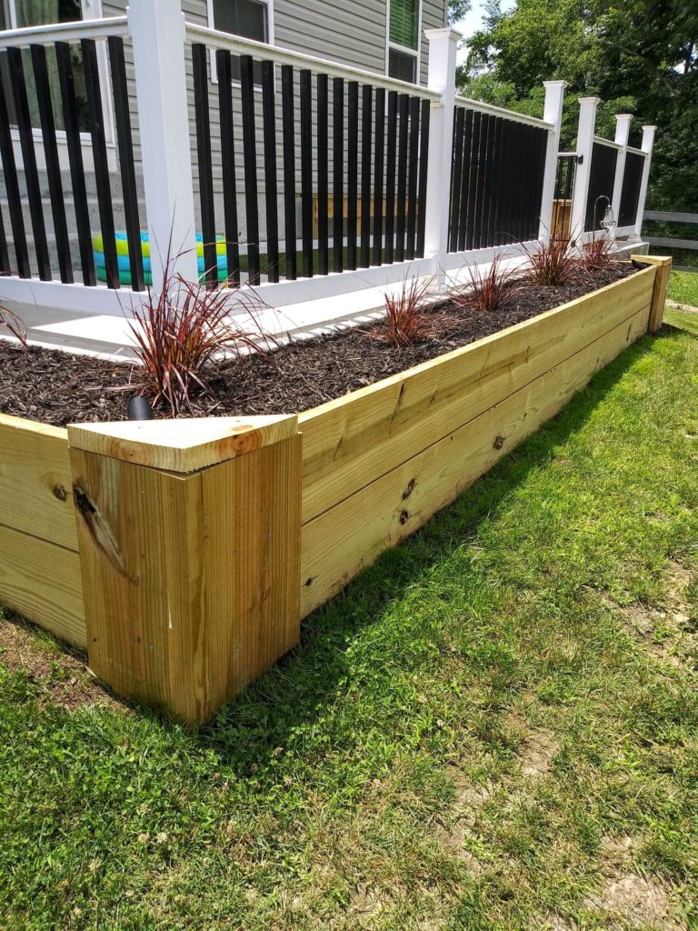 front view of treated lumber flower bed