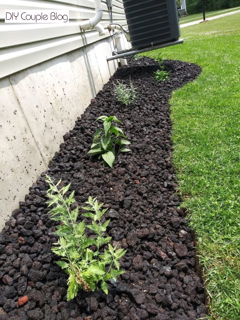 creating a low maintenance beautiful landscaping feature around our air conditioner unit