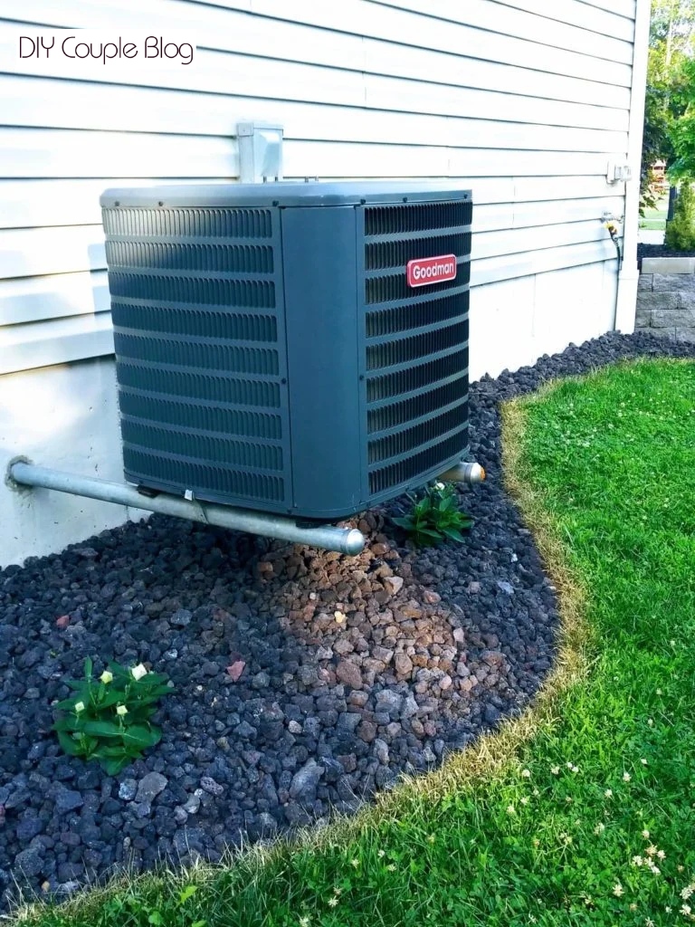 rock landscaping underneath ac unit for a sleek modern aesthetic.