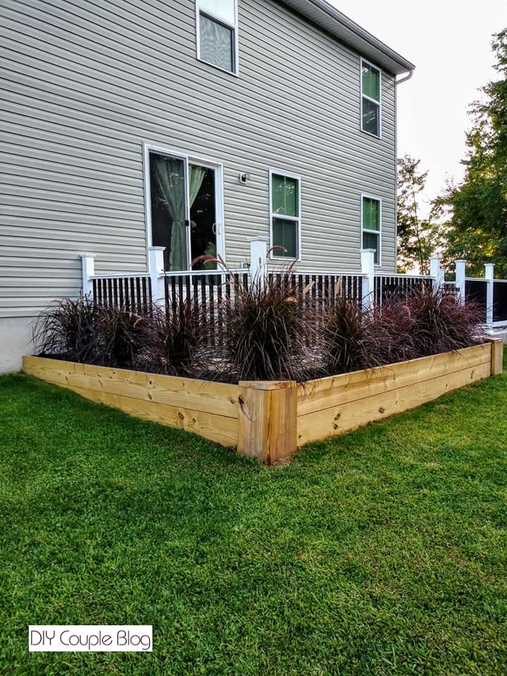 finished outdoor project using lumber for a wood raised bed