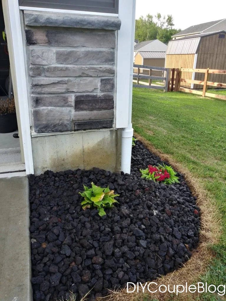 adding black lava rocks for landscaping around the side of our house for easy curb appeal