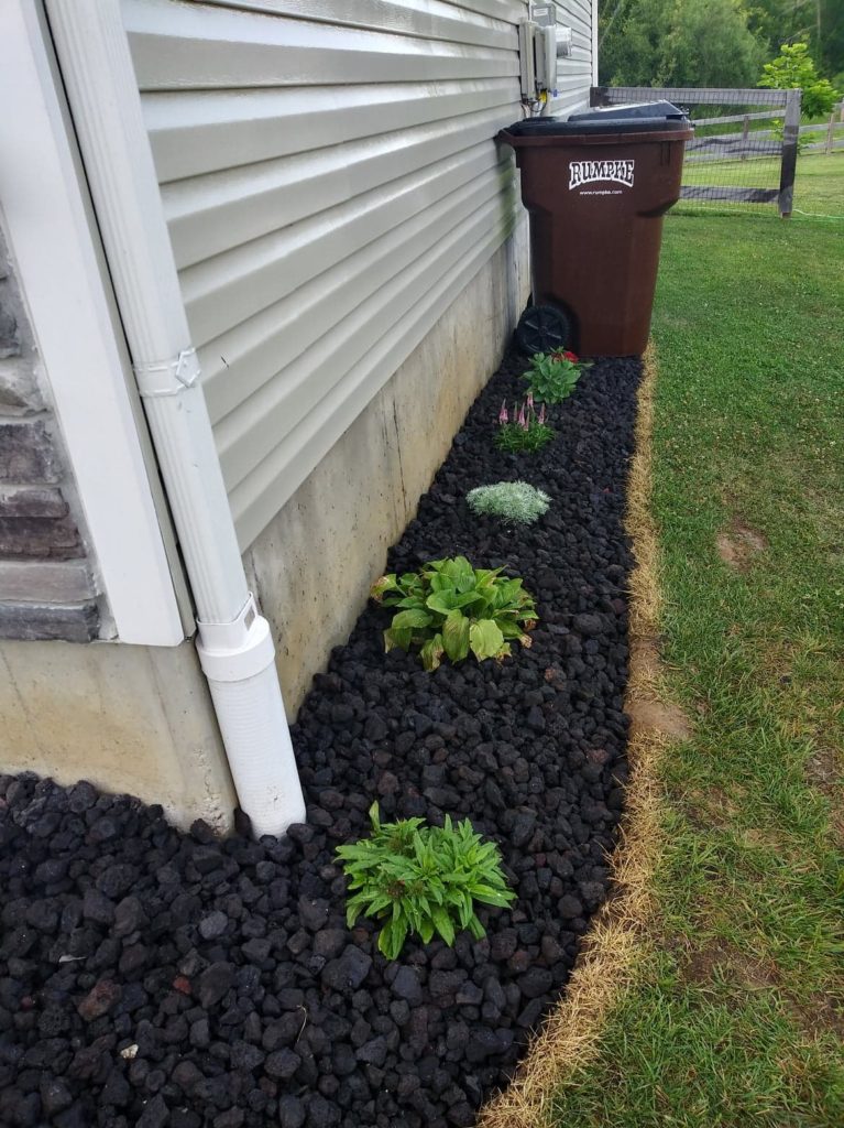 added rocks to side of house-another photo of it completed