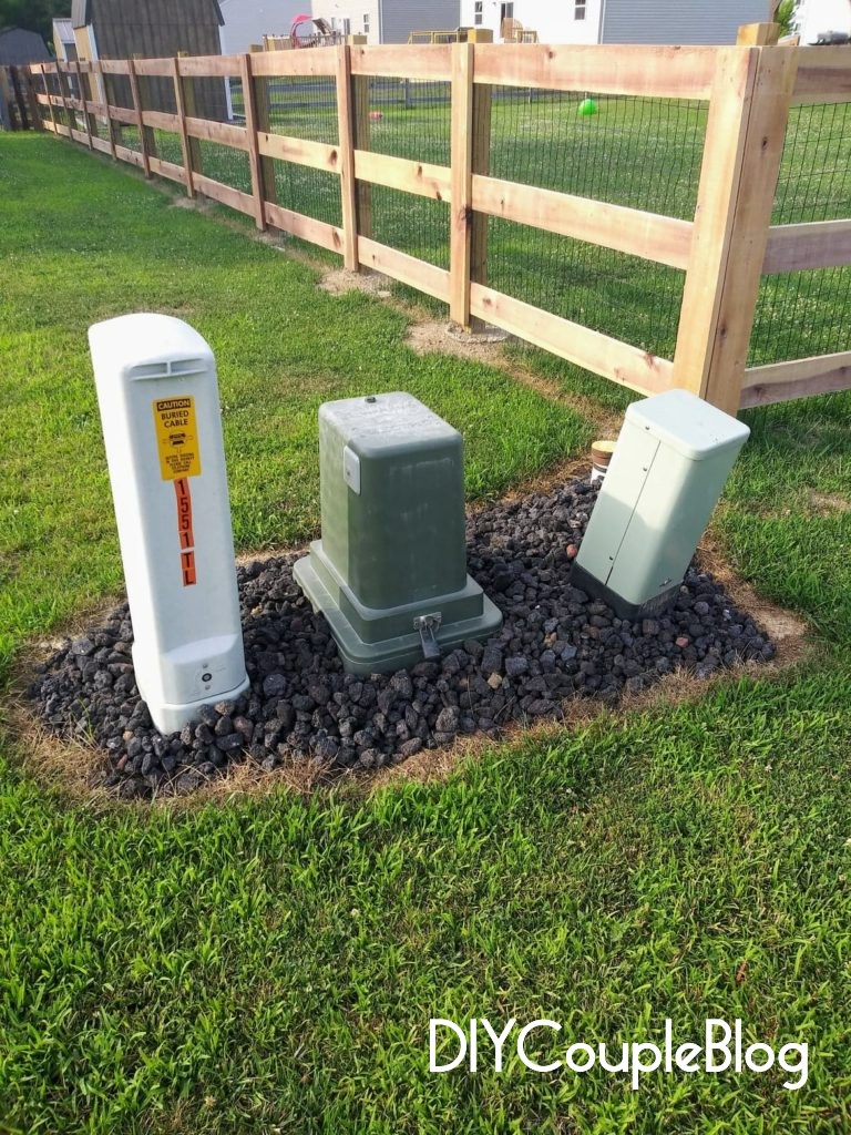 landscaping around utility boxes with rock