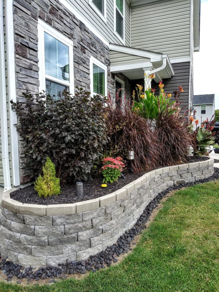 best flower bed ideas with stone and retaining wall