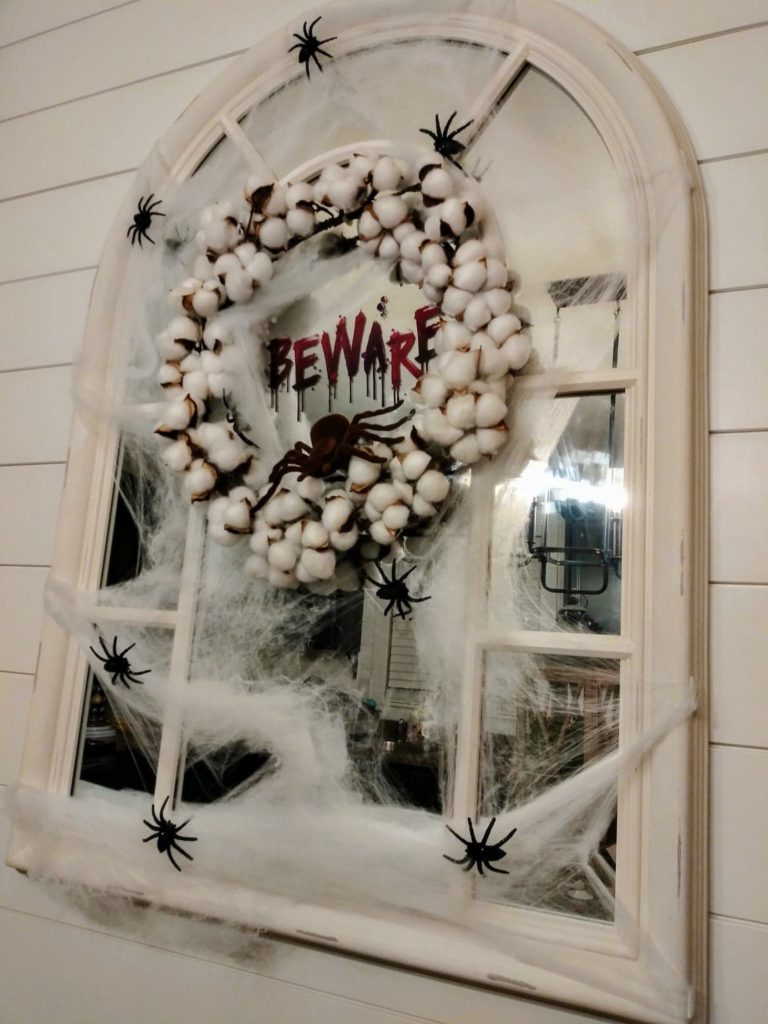 mirror decorated for halloween with a "creepy look"