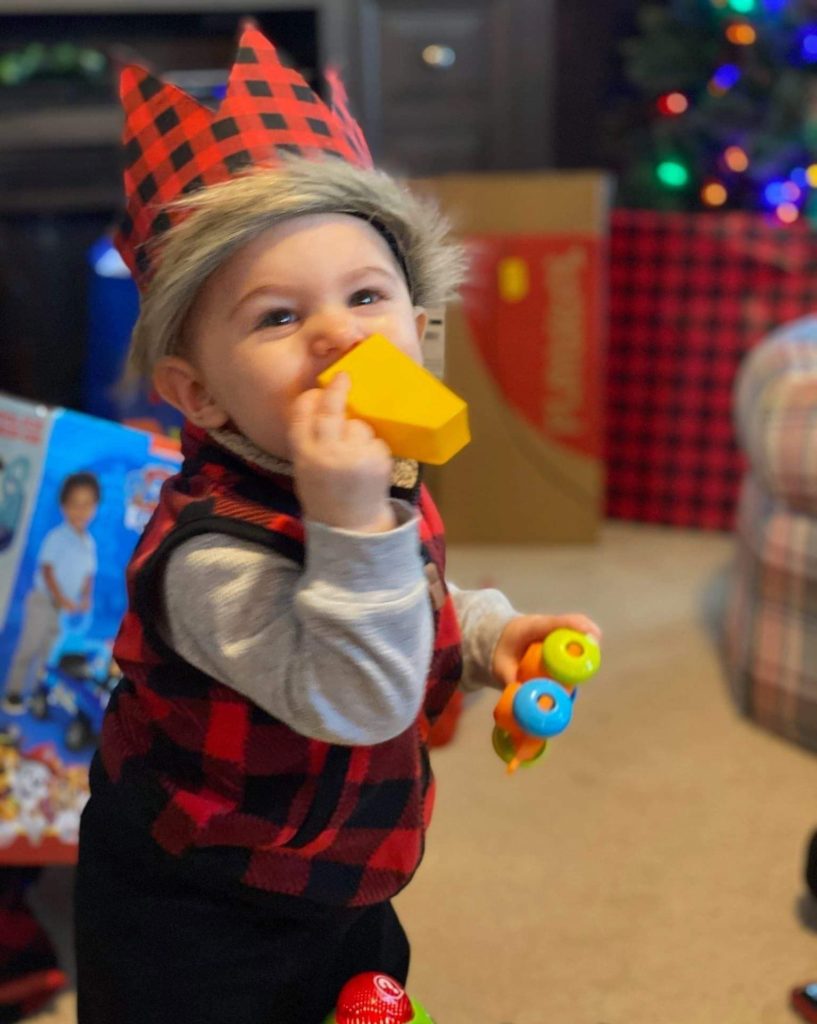 my son in his crown at first birthday party