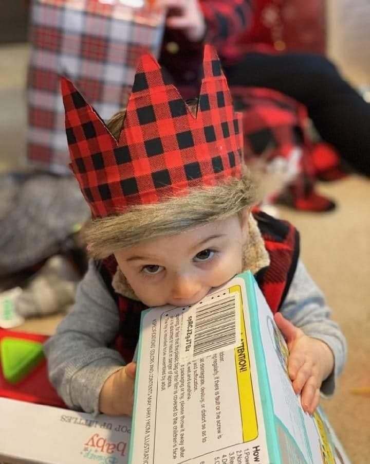 another photo with crown while opening gifts