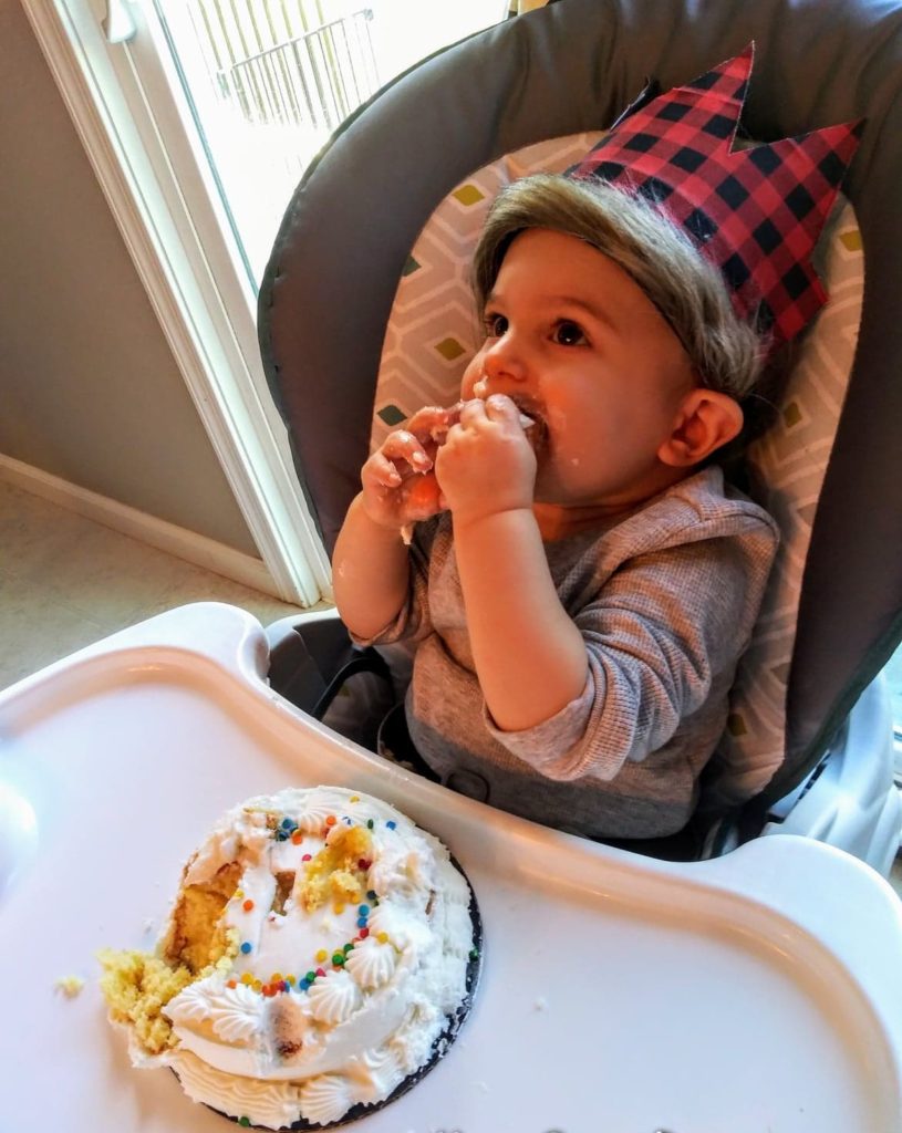 wearing the crown for the cake smash