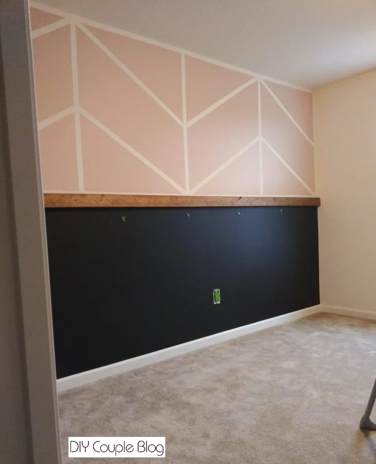 painted black board and batten wall section on lower half of nursery wall