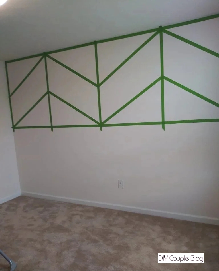 taping off our design with painters' tape for a modern accent wall