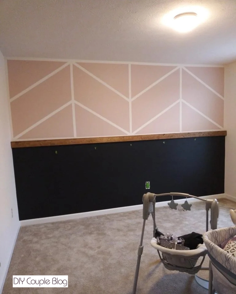 pink and black accent wall for a girl nursery wall