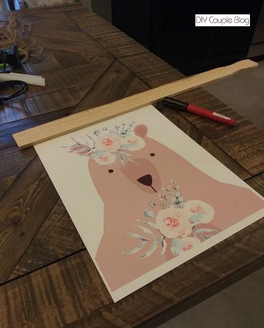 making a rustic frame to hang girl's nursery printable on the wall