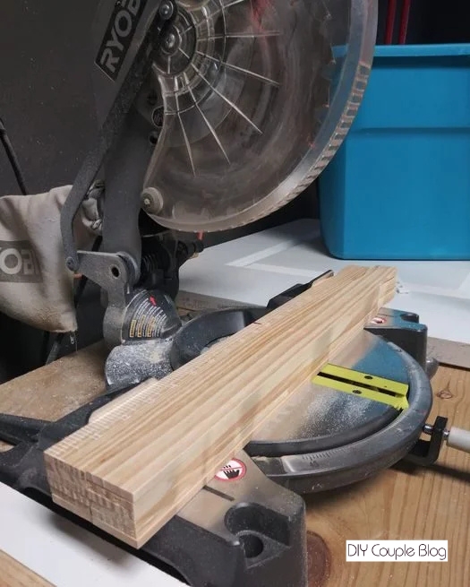 preparing to cut the paint mixing sticks to craft an easy DIY frame