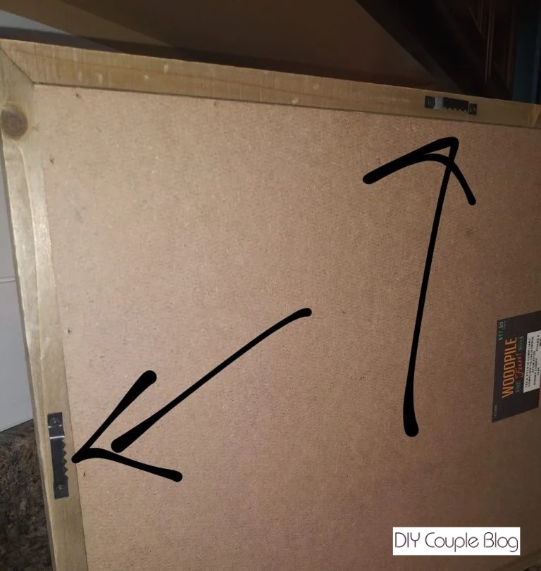 the back of sign where hanging wall clips are placed