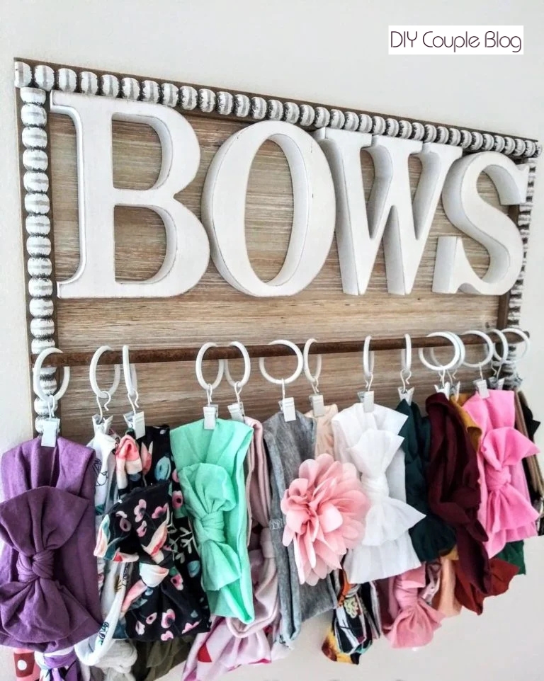 close-up of a custom hanging headband display sign on a bedroom wall