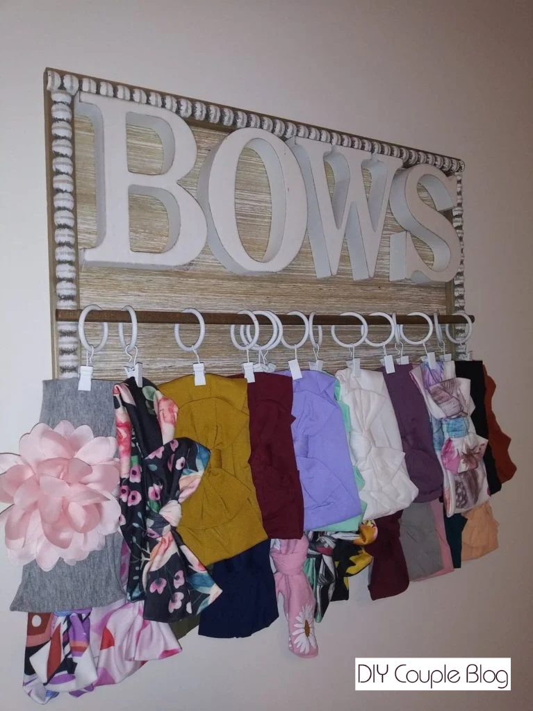 completed craft project holding multiple headbands using small curtain clips
