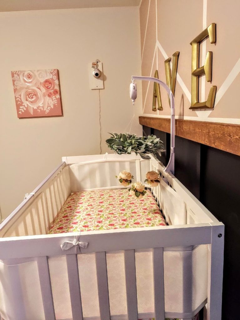 photo with wall decor and crib decor