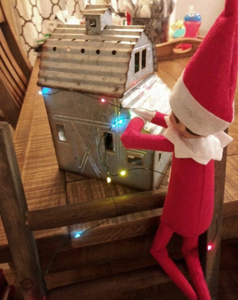 elf on the shelf hanging christmas lights
