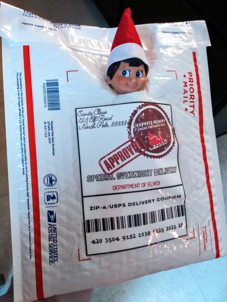 elf in a envelope package with shipping label