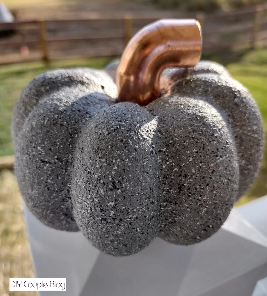 vintage chic pumpkin home decor with faux concrete look and copper stem