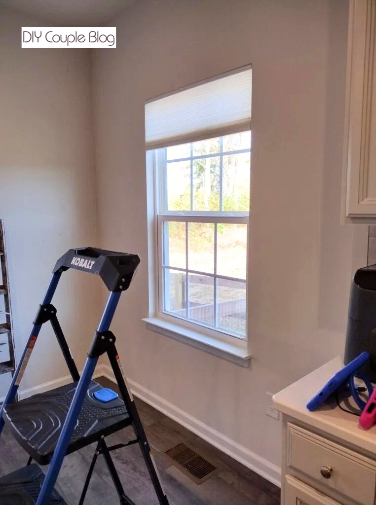 before photo showing a plain window with blinds