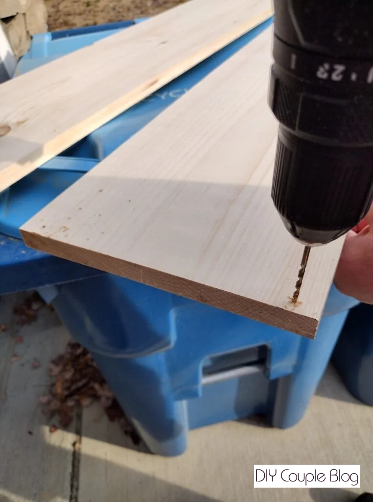 predrilling holes to attach the frame